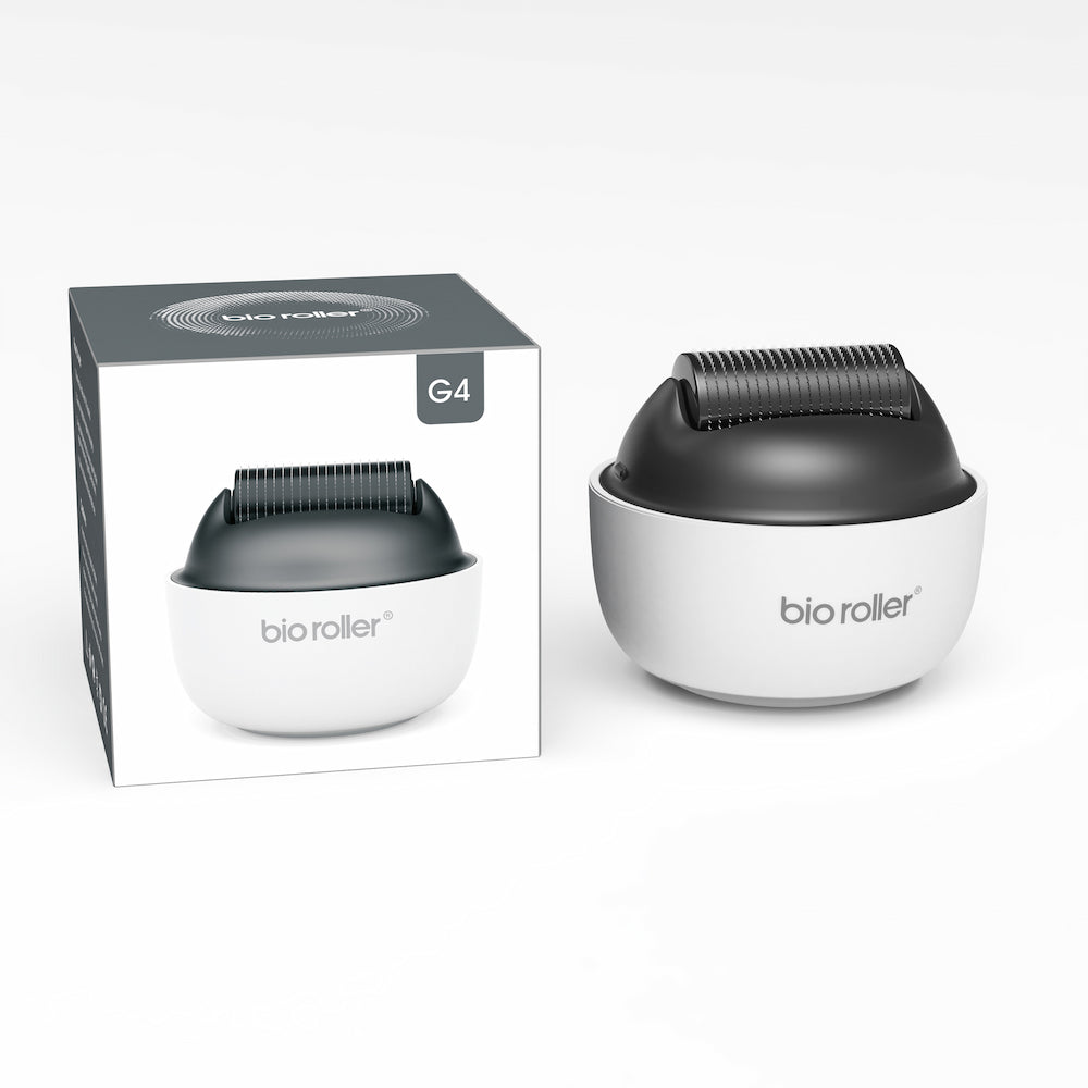 Bio Roller G4 microneedling-rulla yhdessä tuotepakkauksen kanssa, suunniteltu kasvohoitoon, ihon nuorentamiseen ja parantuneeseen seerumin imeytymiseen.