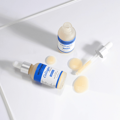 Neutriherbs Collagen + Peptides Serum 30 ml avoimella pullolla, pipetillä ja seerumikoostumuksella. Lähikuva, joka näyttää silkkisen pehmeän koostumuksen ja käytännöllisen pipettiannostelijan tarkkaa annostelua varten.